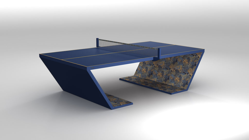 The Cabaret Ping Pong Table is a modern, luxury game table featuring a sleek, angular design with a blue and white finish and unique floral patterns on the sides, set against a plain white background.