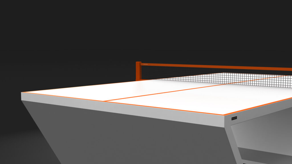 The Cabaret Ping Pong Table features a modern, minimalist design with white surfaces, orange accents, and a black net. Only part of the table and net are shown against a plain dark background.
