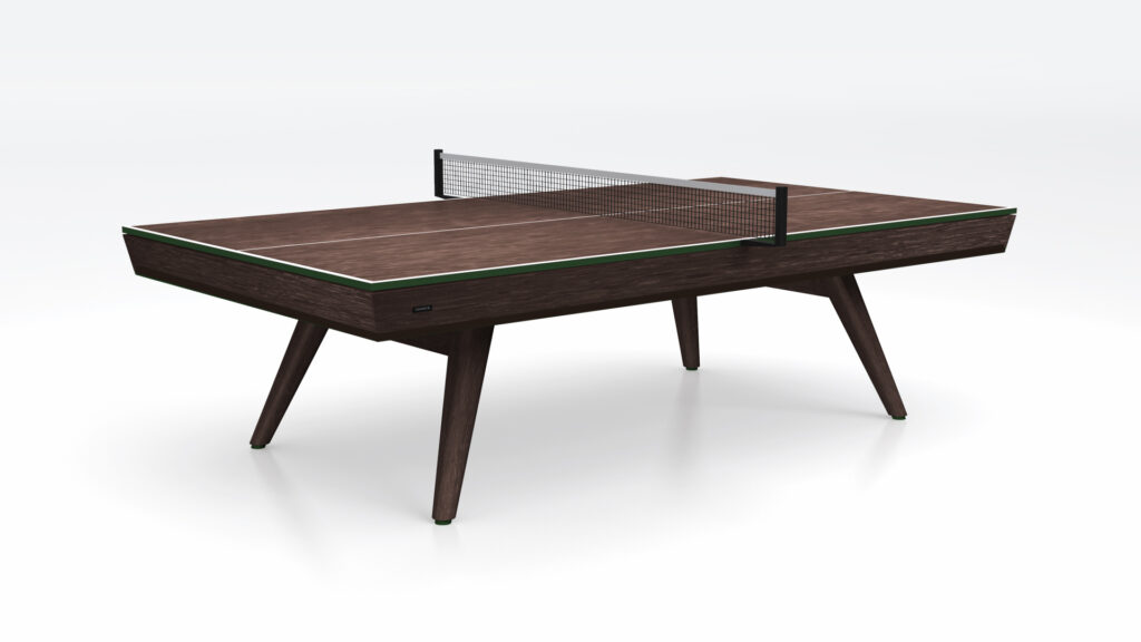 The Hamptons Ping Pong Table is a modern, dark wood table with angled legs and a black net, displayed against a plain white background.