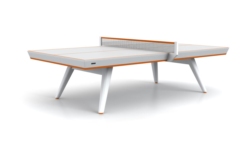 The Hamptons Ping Pong Table features a modern, minimalist design with a white surface, orange accents, four angled legs, and a metal net—perfect for stylish playrooms or living spaces.