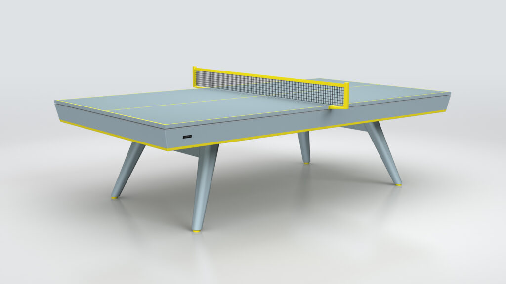 The Hamptons Ping Pong Table features a modern, minimalist design with light blue and yellow accents, angled legs, and a matching net, all set against a simple light background.