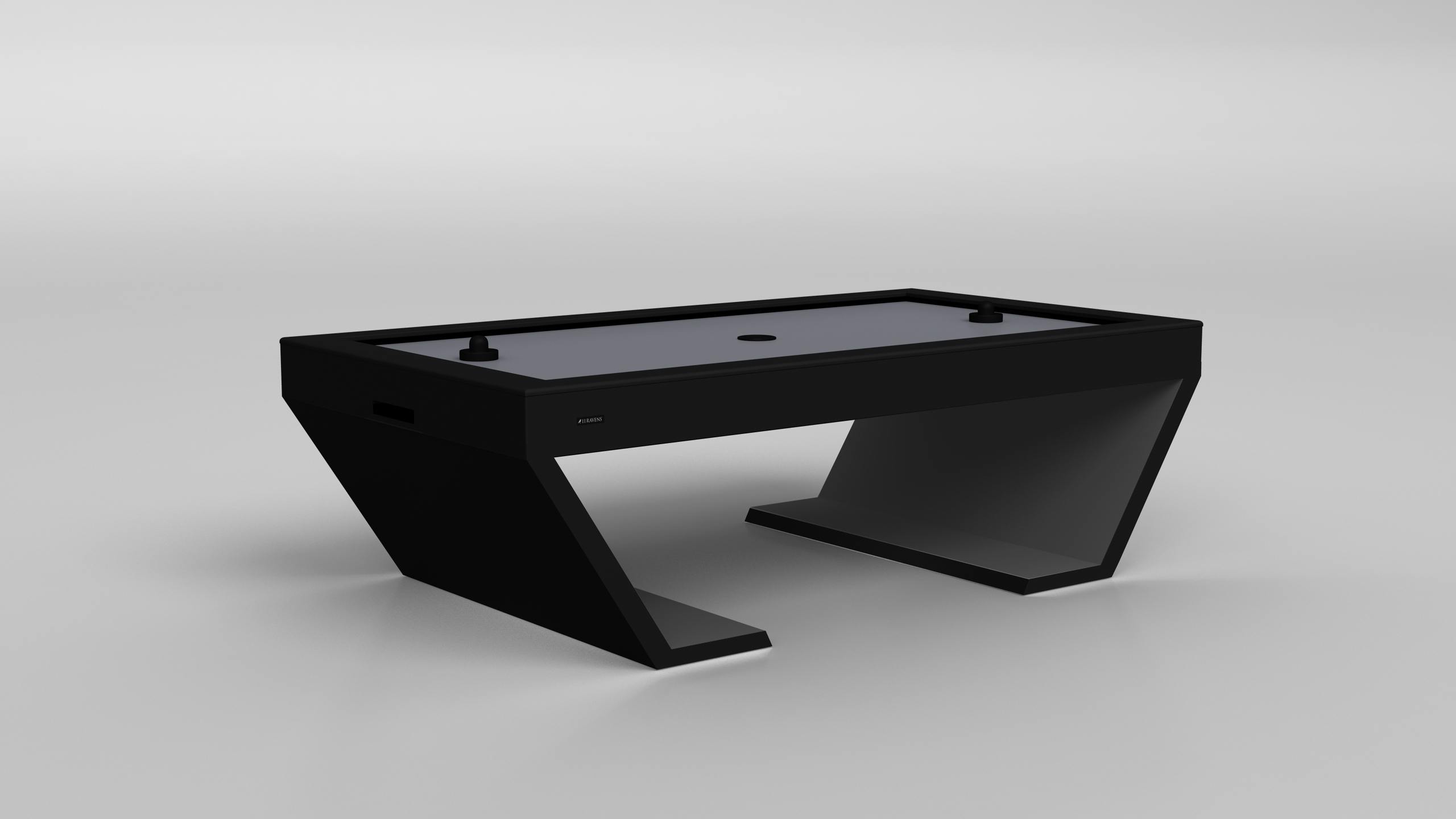 The Cabaret Air Hockey Table features a modern, angular design with two paddles and a smooth gray surface, presented against a simple light background.