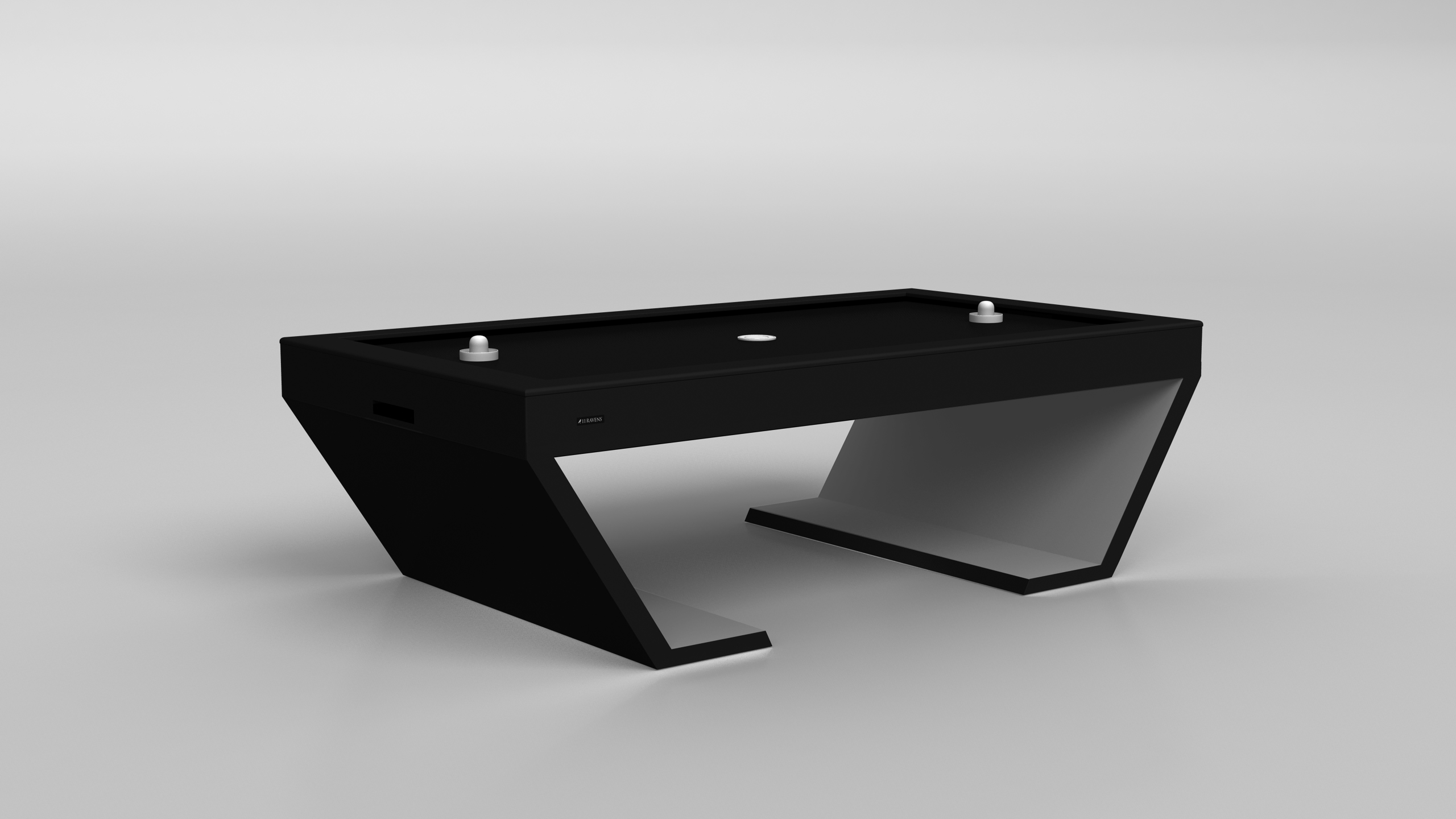 The Cabaret Air Hockey Table features a sleek, angular black design and comes with two white paddles, shown set on the table against a plain light gray background.