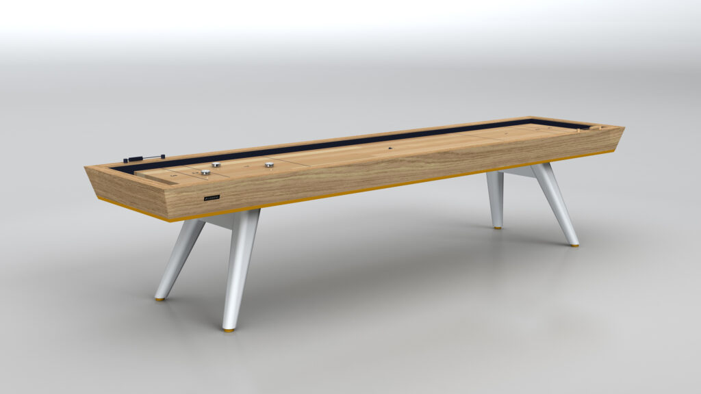 The Hamptons Shuffleboard Table, with a wooden playing surface, white angled legs, and yellow accents, stands elegantly against a plain light-gray background.