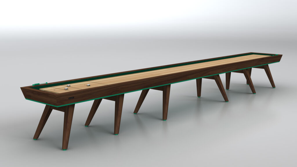 The Hamptons Shuffleboard Table showcases a sleek wooden playing surface, distinctive angled legs, and stylish green accents, all set against a simple light background.