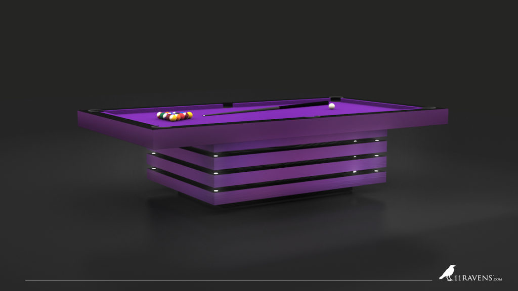 The Arclight Pool Table, a sleek, modern purple piece with chrome accents and LED lights, stands as a centerpiece among luxury game tables. A set of pool balls sits at one end, its vibrant color highlighted by the dark background. The 11 Ravens logo adorns the corner.