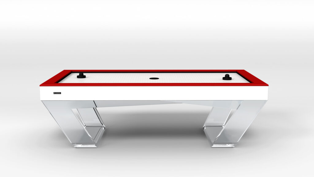 The Avettore Air Hockey Table boasts a white surface, red border, two black strikers, and a black puck. Stylish transparent legs and a minimalist design make it an elegant centerpiece against any plain white background.