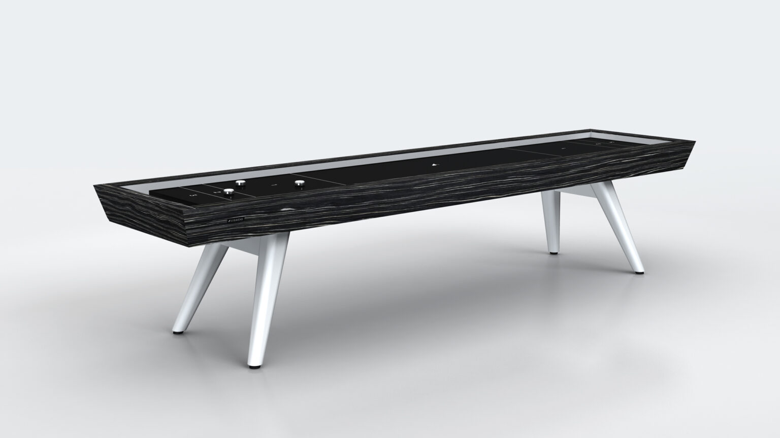 The Hamptons Shuffleboard Table features a modern rectangular design with a dark wood finish, angled white legs, and sleek minimalist style, shown against a light gray background.