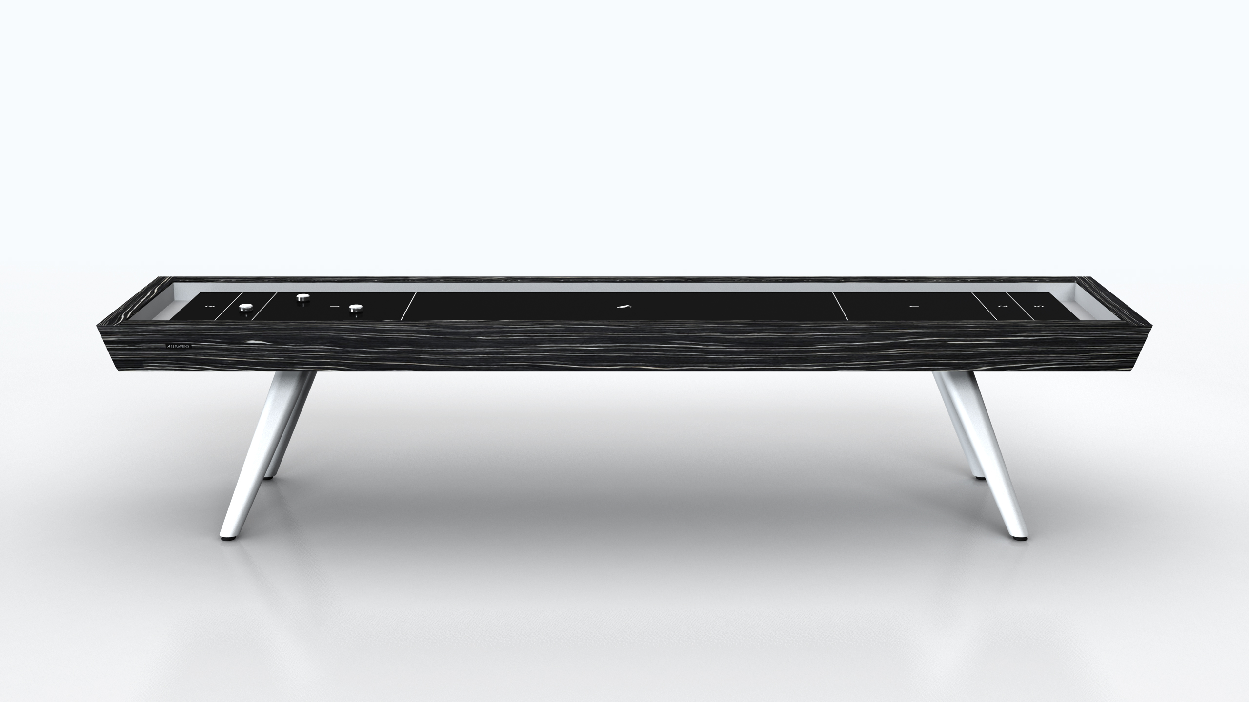 The Hamptons Shuffleboard Table features a modern rectangular design with a dark wood finish and angled white legs, displayed against a plain light background.