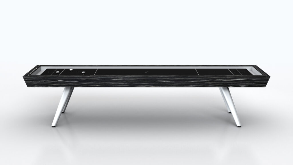 The Hamptons Shuffleboard Table, from our luxury game tables collection, features a sleek dark wood finish and slender white legs. Set against a plain white background, it offers a smooth playing surface with elegantly arranged pucks on top.