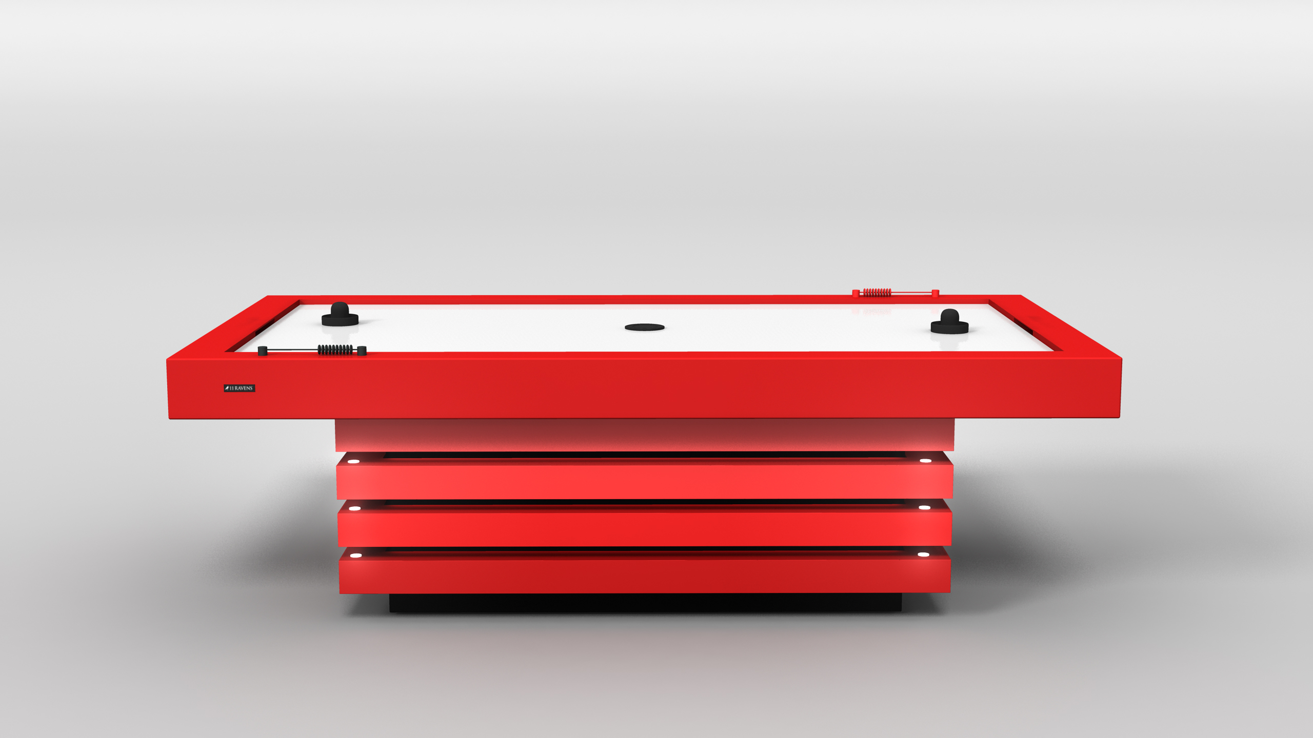The Arclight Air Hockey Table features a modern look with a red frame, white playing surface, black pucks and strikers, all set against a plain light gray background.
