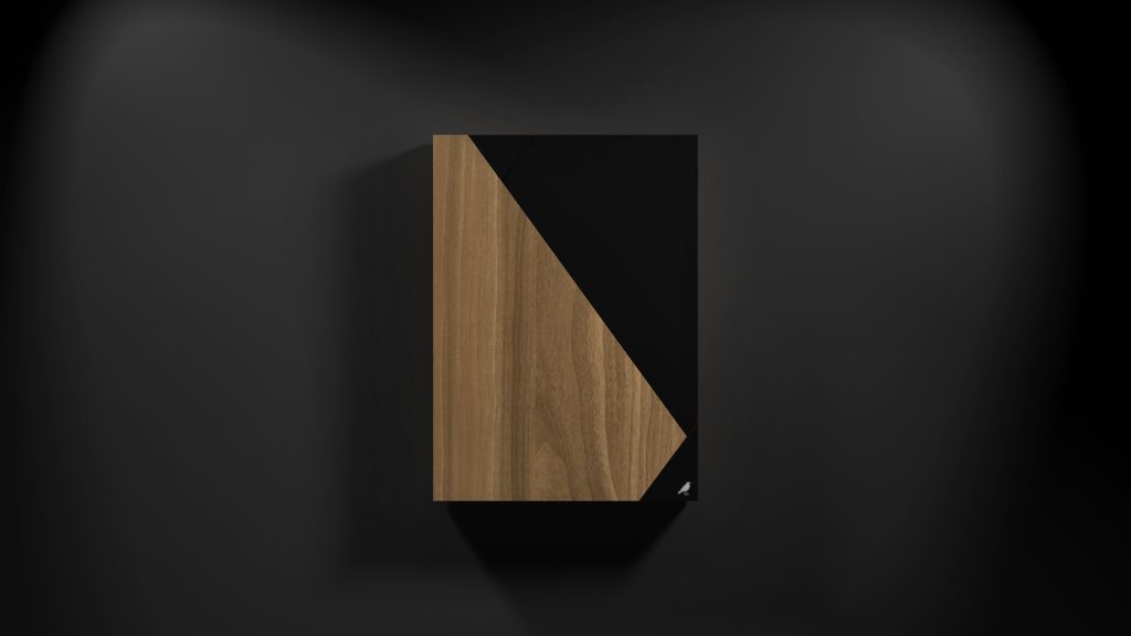 A chic, wall-mounted wooden cabinet featuring a diagonal black front panel against a dark backdrop exudes luxury through its clean lines and minimalist design, reminiscent of the precision found in the Cardinal Dartboard.