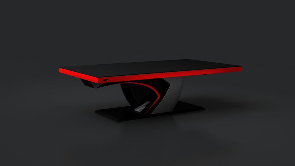 A sleek gaming desk with a black surface and red edge, similar to the Force Convertible Pool/Dining/Ping Pong Table. Its angular supports with red accents pop against the dark backdrop, and it features a USB port on the edge for easy connectivity.