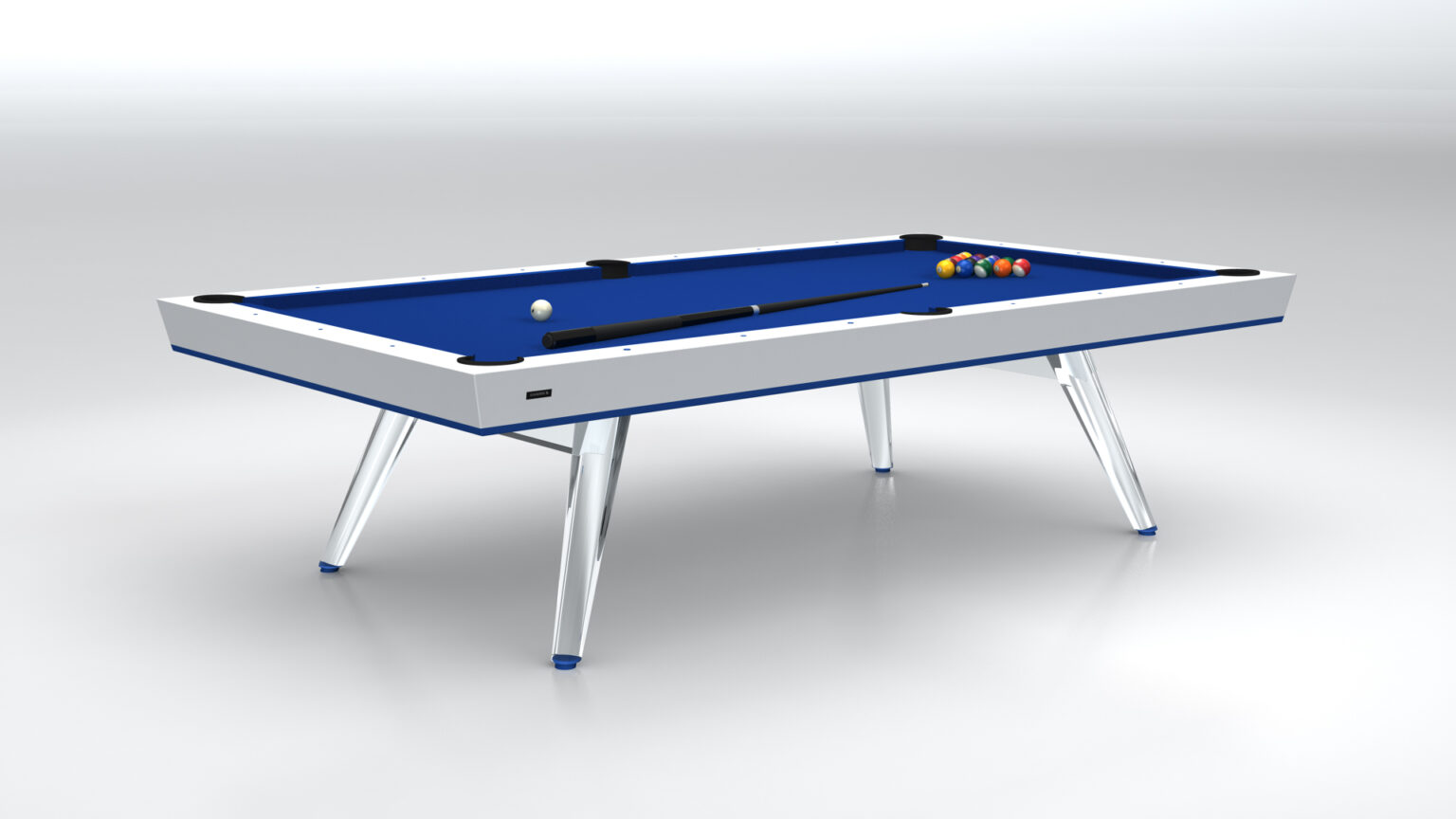 The Hamptons Pool Table is a luxurious addition with a modern design, featuring a blue felt surface, sleek white frame, and four metallic legs. It includes a cue stick, white cue ball, and colorful balls arranged in a triangle against a simple light gray backdrop, highlighting its chic style.
