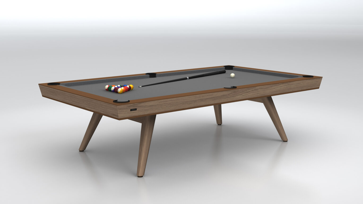 The Hamptons Pool Table is a luxury game table with a sleek wooden frame, angled legs, and a smooth surface. It showcases a black felt top complete with cue stick and racked balls, set against a minimal light gray background.