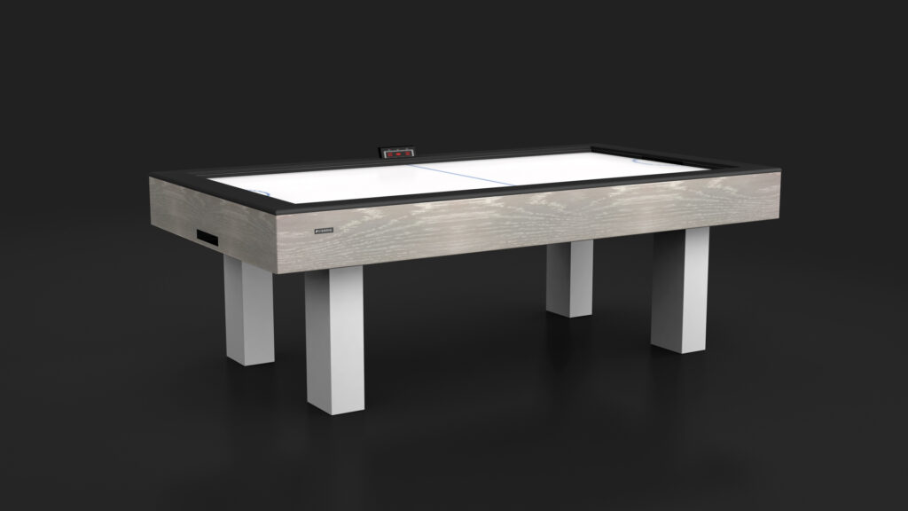 The Malibu Air Hockey Table offers a light wood finish, white legs, digital scoreboard, and smooth white playing surface for a modern look that stands out against dark backgrounds.