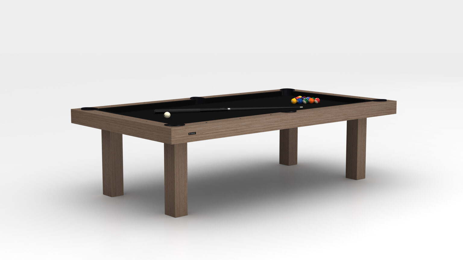 The Malibu Pool Table, a luxury game table with a wooden frame and black playing surface, showcases a set of pool balls arranged in a triangle with a cue stick resting on top, all against a plain white backdrop.