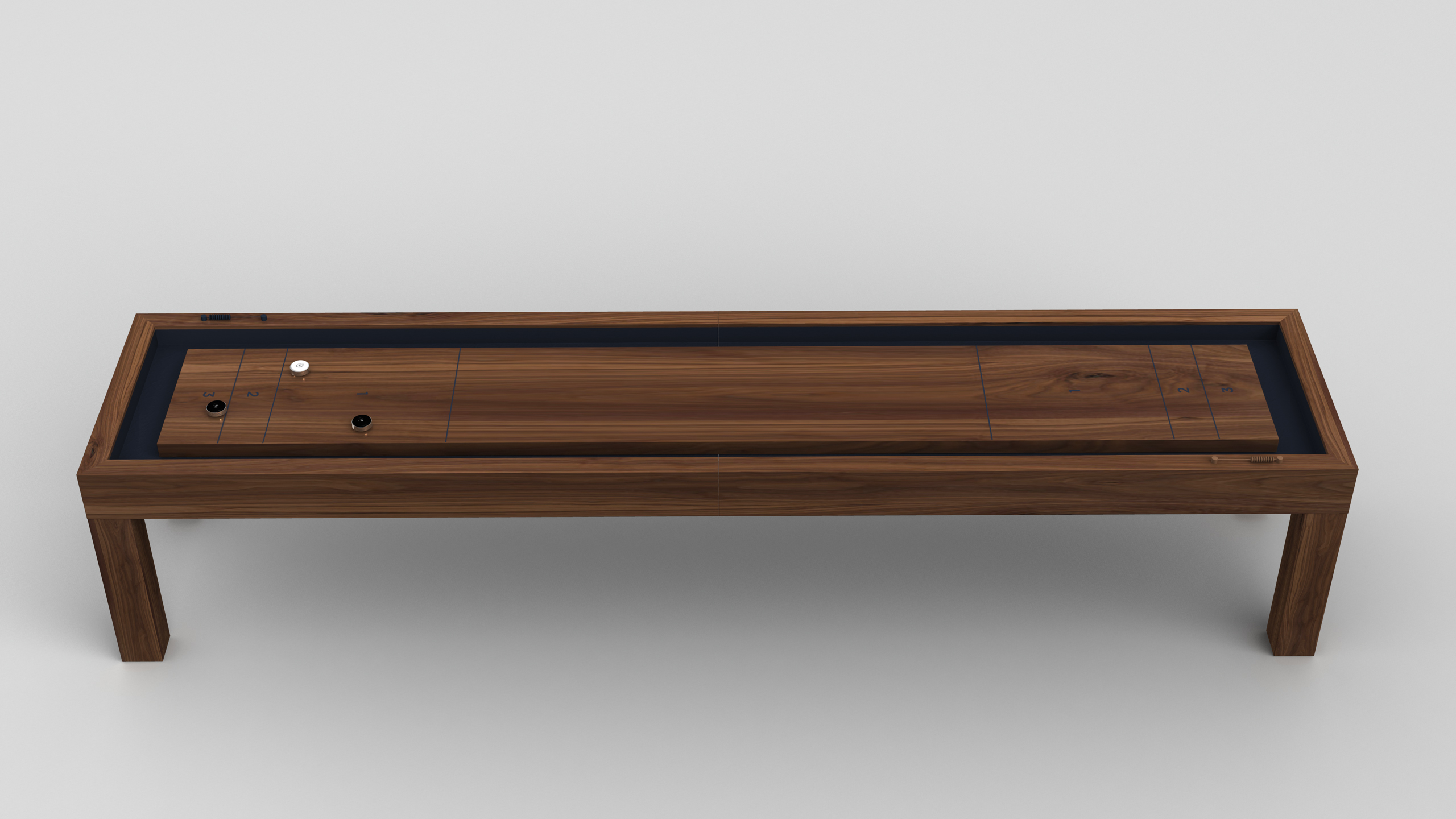 The Malibu Shuffleboard Table features a wooden playing surface with four pucks—two black and two white—arranged on top, set against a plain white background.