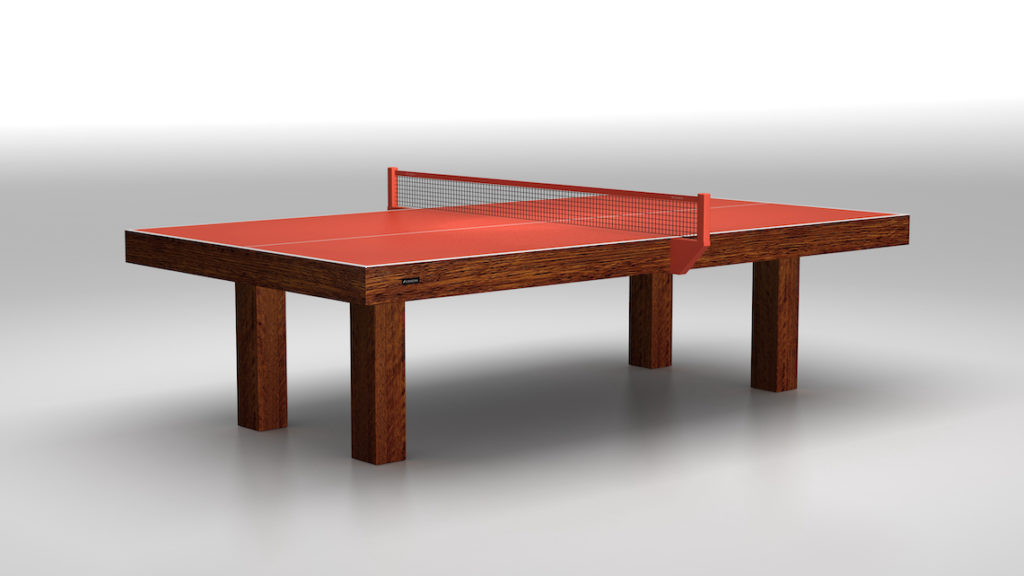 The Malibu Ping Pong Table is a luxury game table with a brown finish, featuring a red playing surface and net, set against a plain gray background.