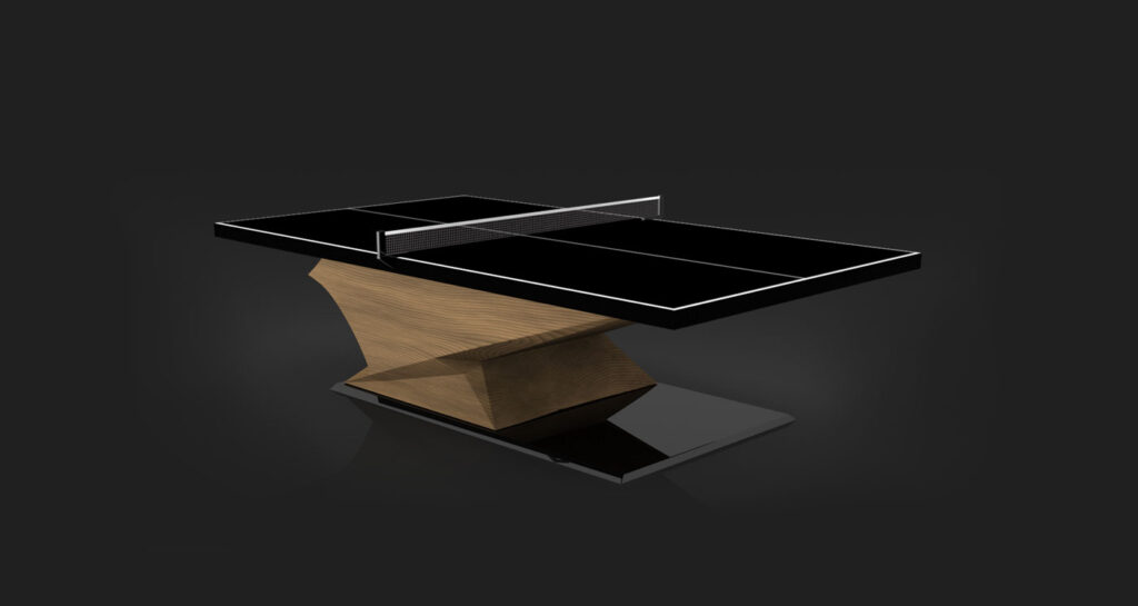 The Raven Ping Pong Table showcases a sleek black surface with white lines, a metal net, and an angular wooden pedestal base on a glossy black platform, set against a dark background.
