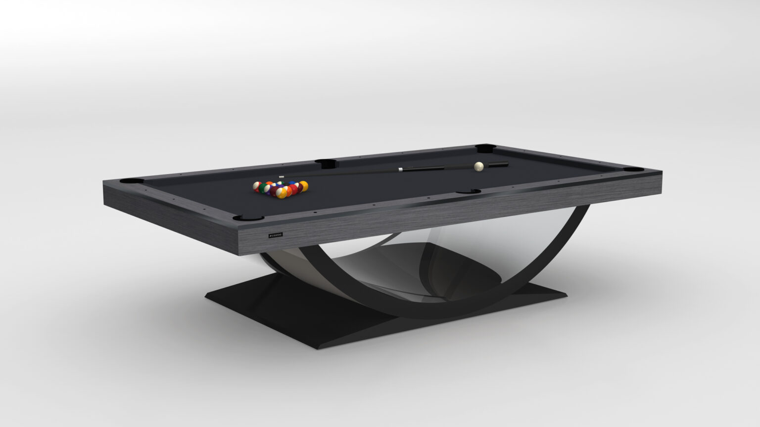 The Theseus Pool Table, a luxurious game table centerpiece, boasts a sleek black finish and distinctive curved base. A vibrant set of pool balls sits at one end, accompanied by a cue stick resting on the surface, beautifully set against a plain white backdrop.