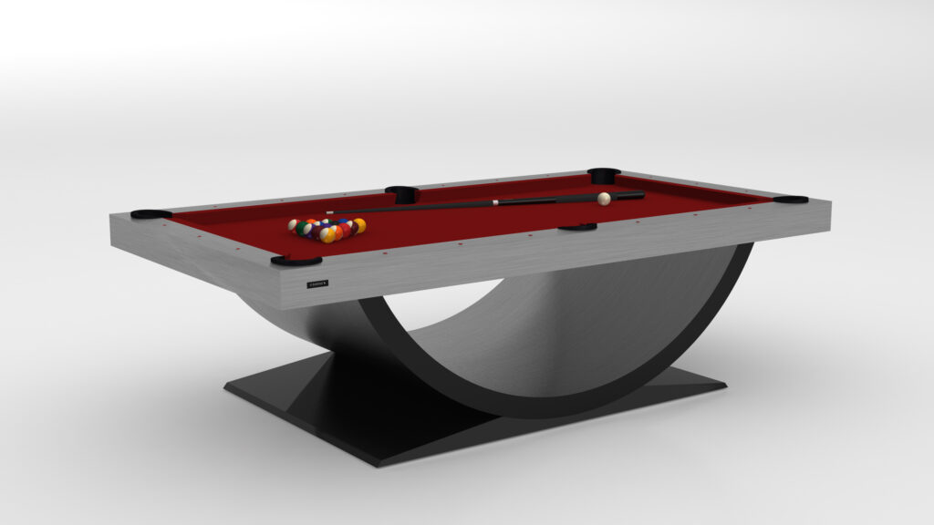 The Theseus Pool Table is a luxury game table featuring a sleek, curved base and vibrant red felt, with colorful billiard balls arranged in a triangle and an elegantly crafted cue stick.