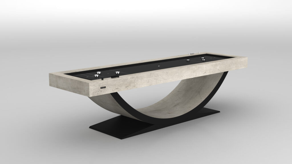 The Theseus Shuffleboard Table features a modern design with a rectangular concrete top and a curved, arch-like base on a black platform, displayed against a simple light background.