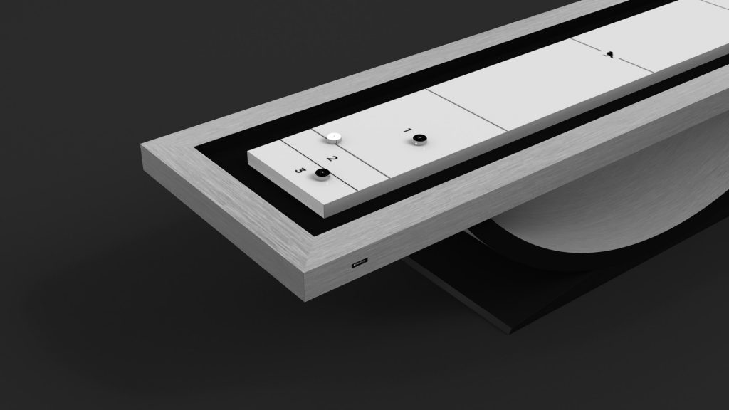 A modern, minimalist timepiece with a sleek rectangular design, featuring a metallic frame and linear display with small circular markers and numbers on a dark background. Its contemporary sophistication echoes the elegance of the Theseus Shuffleboard Table.