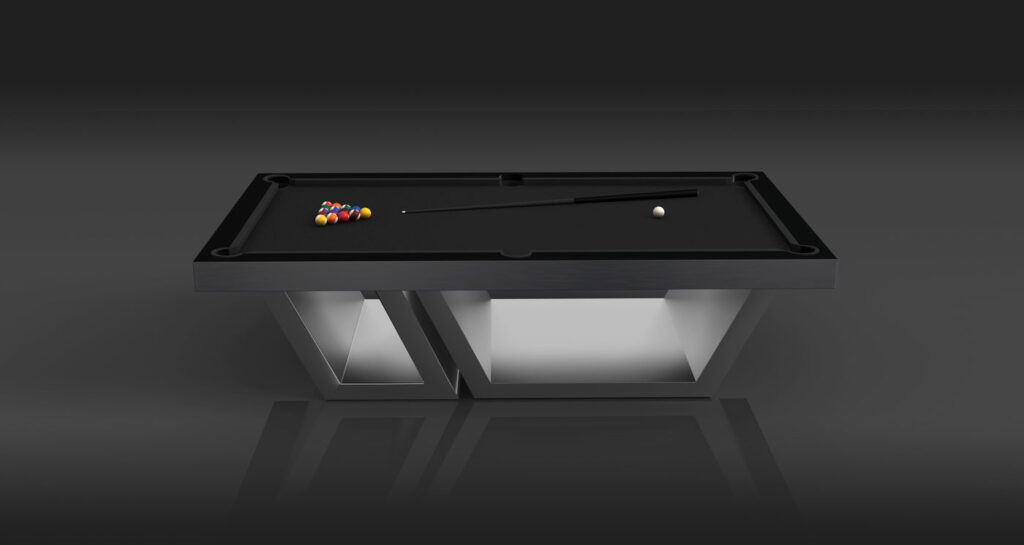 The Titan Pool Table is a luxury game table featuring a modern black design with a sleek geometric base, colorful billiard balls arranged in a triangle, and a cue stick on its surface set against a dark background.