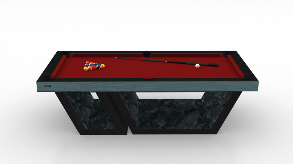 The Titan Pool Table is a modern, artistic luxury game table with a sleek gray marble frame, vibrant red felt top, cue stick, perfectly arranged billiard balls at one end, and a unique geometric design base.