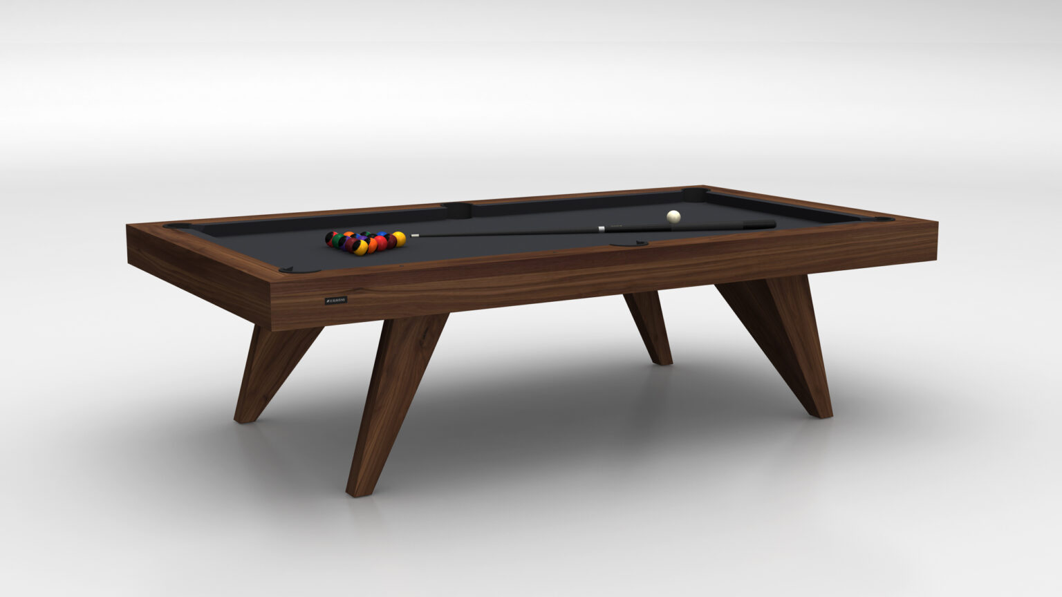 The Trigon Pool Table is a modern luxury game table with a black surface and triangular legs, featuring pool balls arranged at one end and a cue stick resting on the table, all against a plain white background.