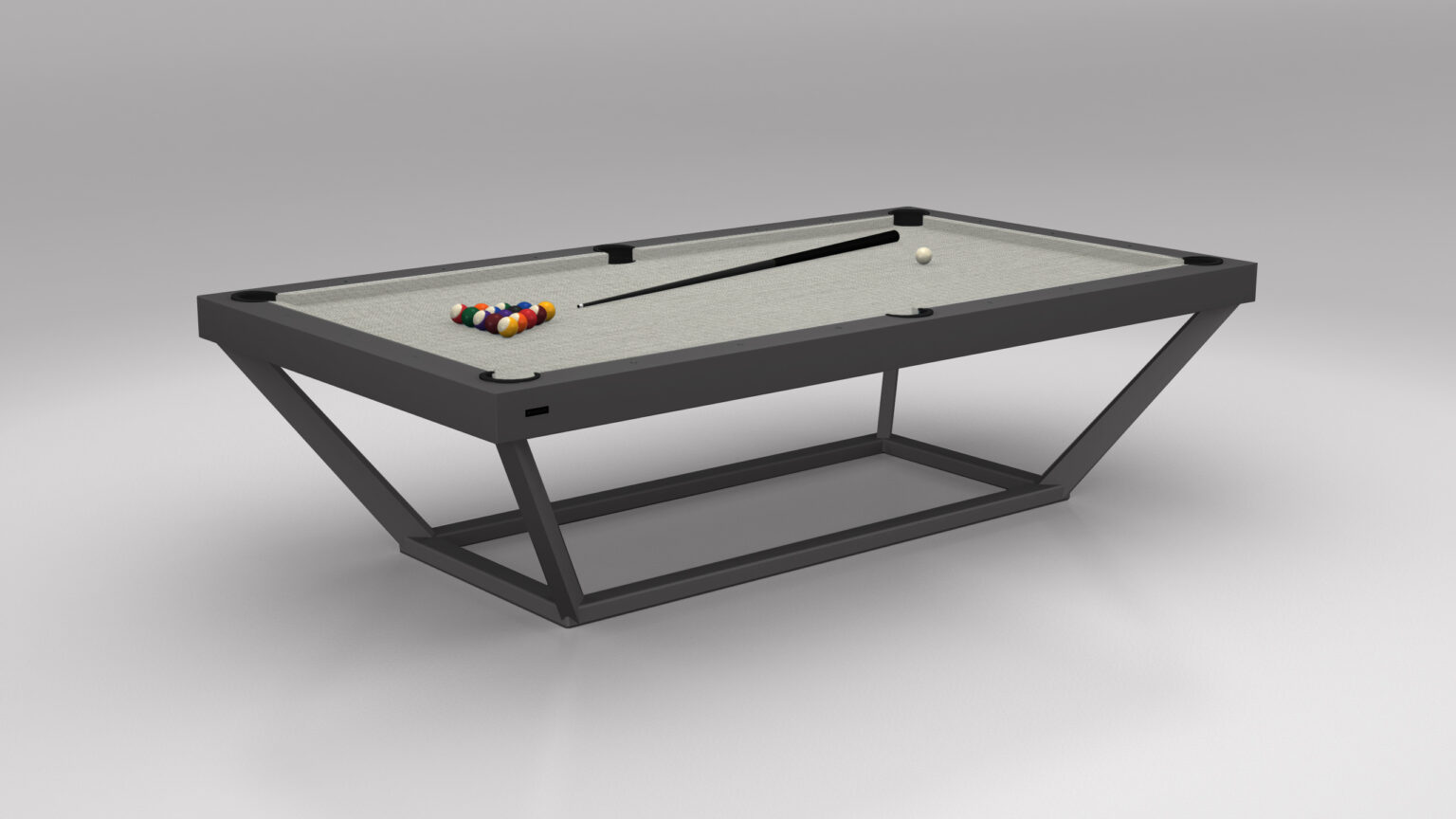 Introducing the Vitro Pool Table, a modern minimalist luxury piece with a sleek gray surface and metal frame. Pool balls are neatly racked at one end, while a cue stick and white cue ball adorn the table set against a plain gray background that enhances its elegance.