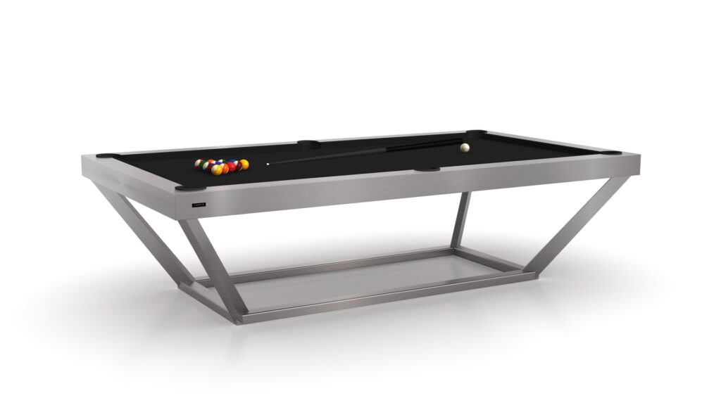 The Vitro Pool Table, with its sleek black surface and metallic frame, epitomizes luxury. A triangle of colored billiard balls sits at one end, while a white cue ball rests nearby. Its angular design is enhanced by a distinctive V-shaped base.