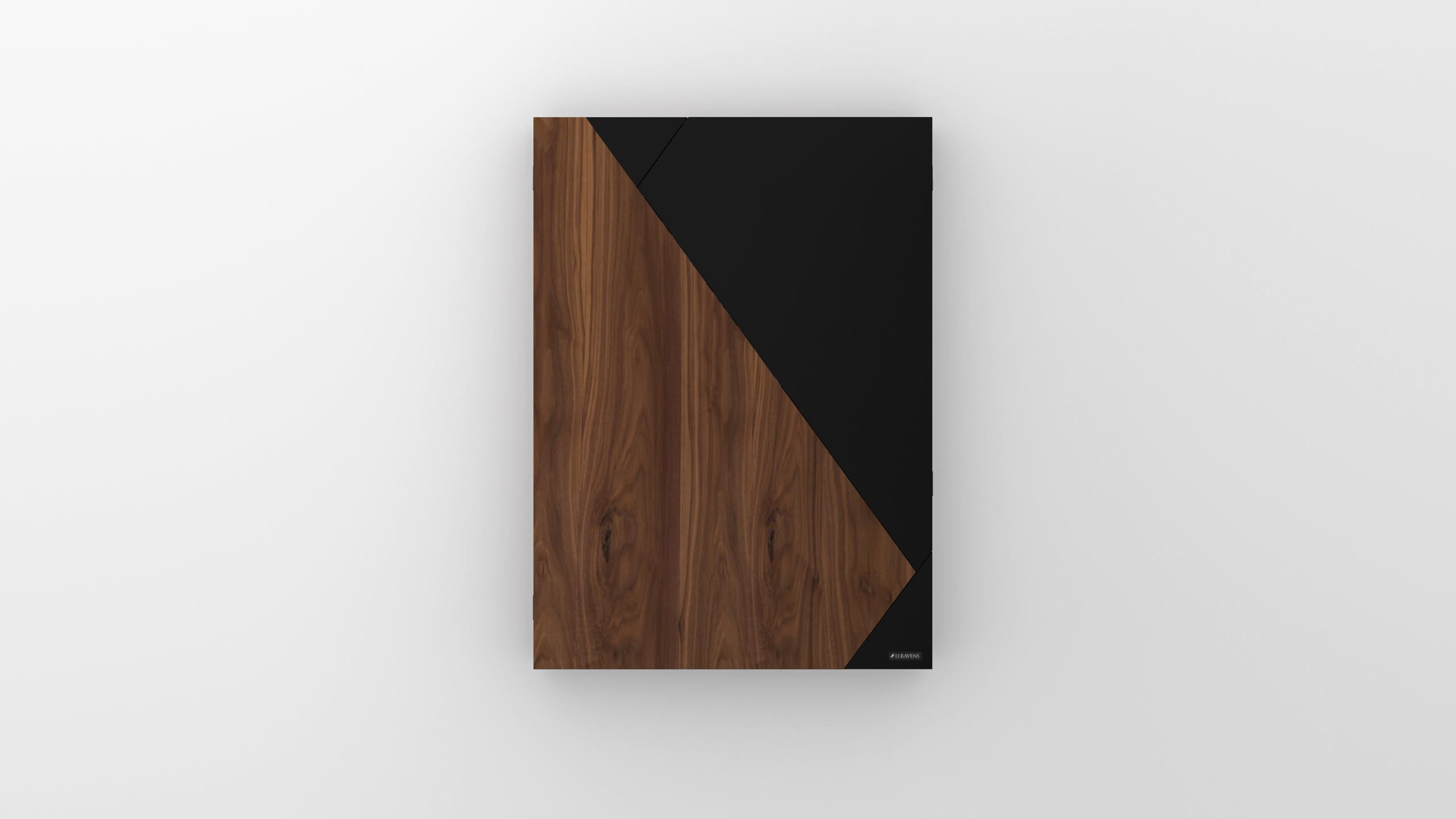 A rectangular object called the Cardinal Dartboard features a geometric design with a diagonal split: dark wood grain on the left and matte black on the right, set against a white background.