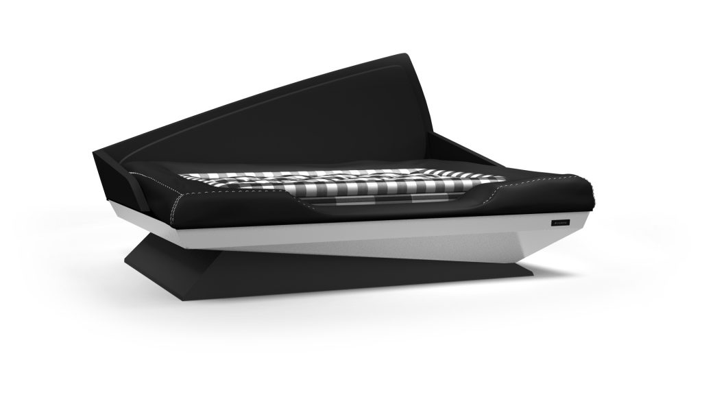 The Cove Dog Bed, featuring a modern angular design with black and gray geometric patterns and a plaid cushion, sits against a plain white background, showcasing its unique futuristic style.