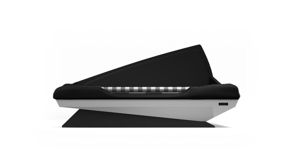 Side view of a sleek black and gray couch featuring a unique angular backrest and plaid-patterned cushion. Reminiscent of the Cove Dog Bed, it flaunts a minimalist, geometric style resting on a single wide base.