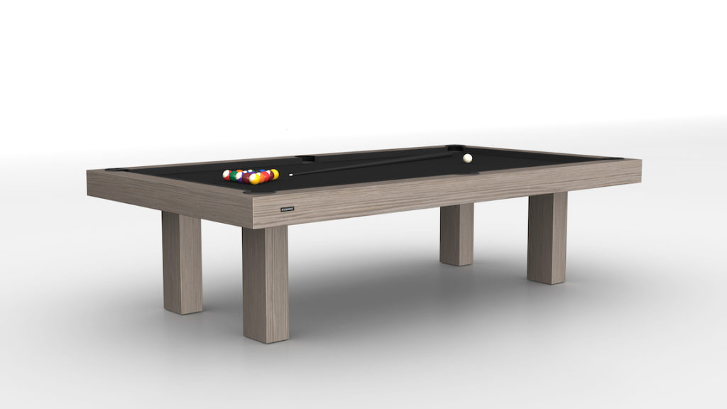 The Malibu Pool Table exudes luxury with its modern design, featuring a light wood finish and sleek black felt. Pool balls are arranged in a triangle, ready for play. Set against a plain white background, its perfect for those who appreciate refined entertainment.