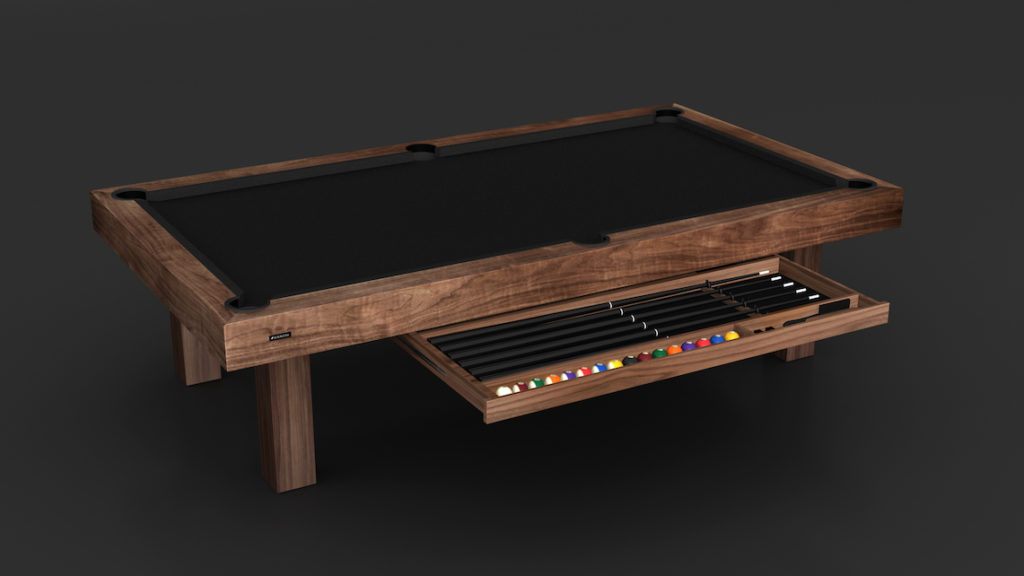 The Malibu Pool Table is a luxury gaming centerpiece with a wooden frame and black felt surface. It features a slide-out drawer housing pool cues and colorful billiard balls, set against a simple dark backdrop.