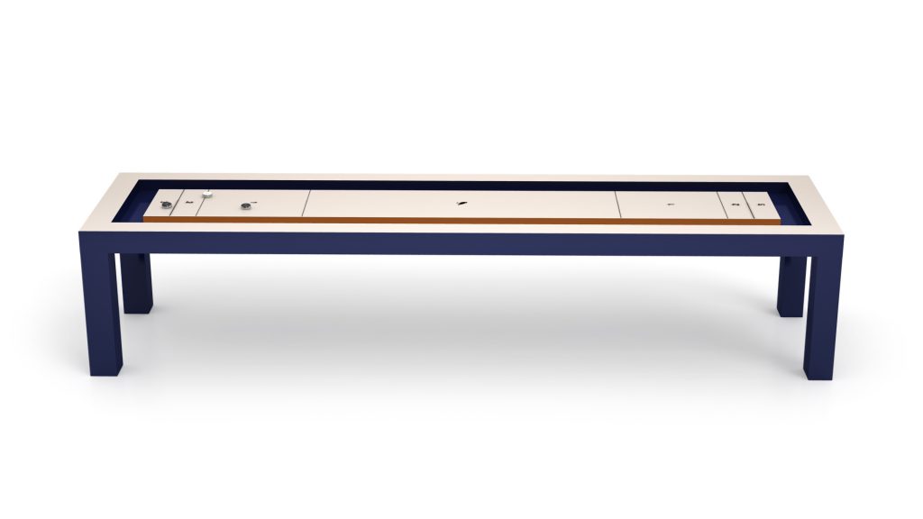A modern Malibu Shuffleboard Table, shaped like a sleek bench with a navy blue frame and rectangular form, features a beige top with geometric designs and cut-out details for a minimalist, contemporary look.