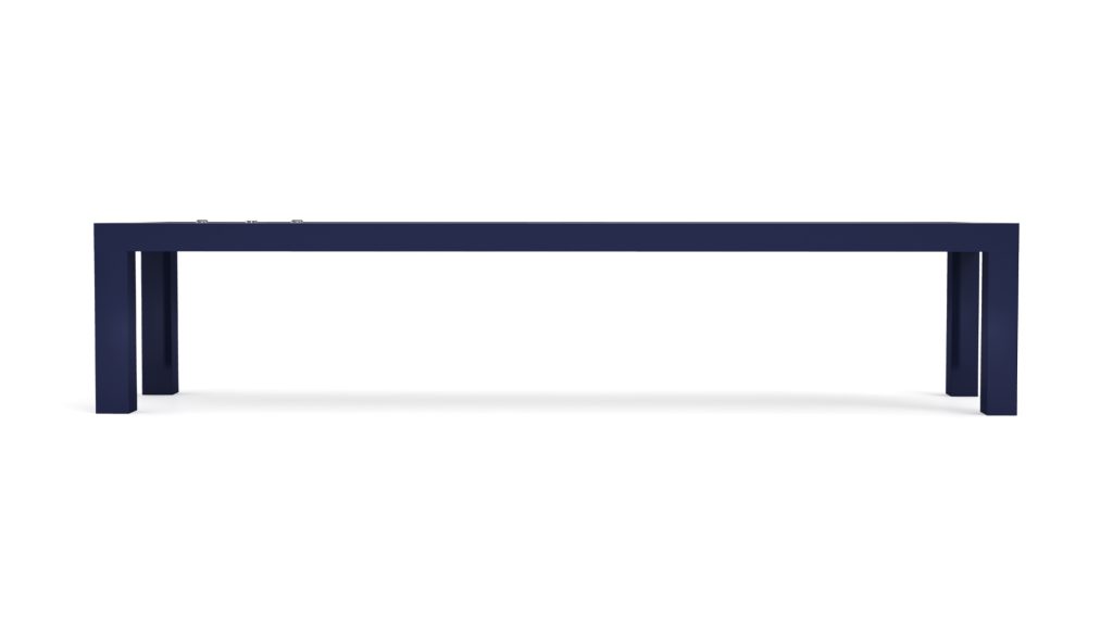 A dark blue rectangular bench with a minimalist flair mirrors the sleek sophistication of a Malibu Shuffleboard Table, with its clean lines and four sturdy legs against a white backdrop, emphasizing modern elegance.