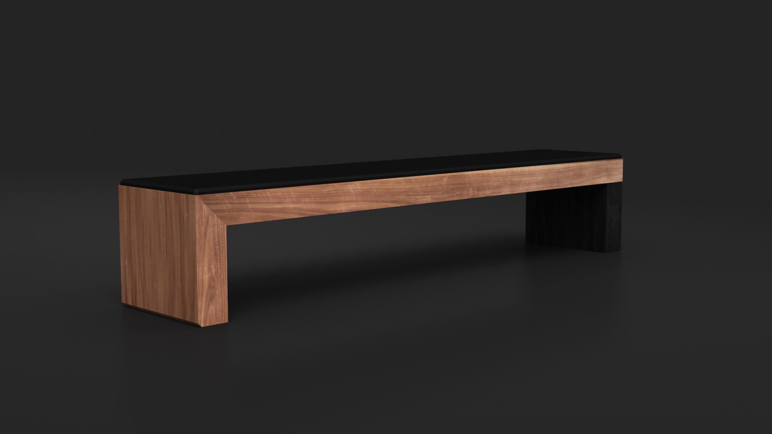 The Malibu Bench is a minimalist wooden piece with a black seat cushion against a dark background. Its modern rectangular design and smooth finish exude elegance and sophistication.