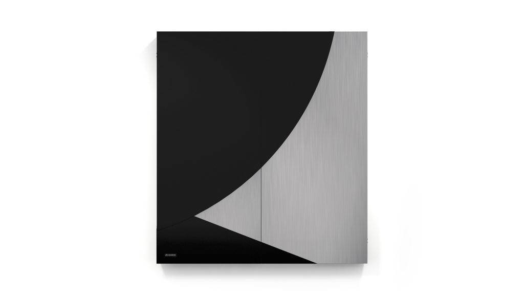 Minimalist wall art with geometric shapes in a black and metallic design, reminiscent of the Phaedra Cue Rack. The piece features a large black semicircle in the upper left that intersects with a metallic gray curve flowing into the bottom right.