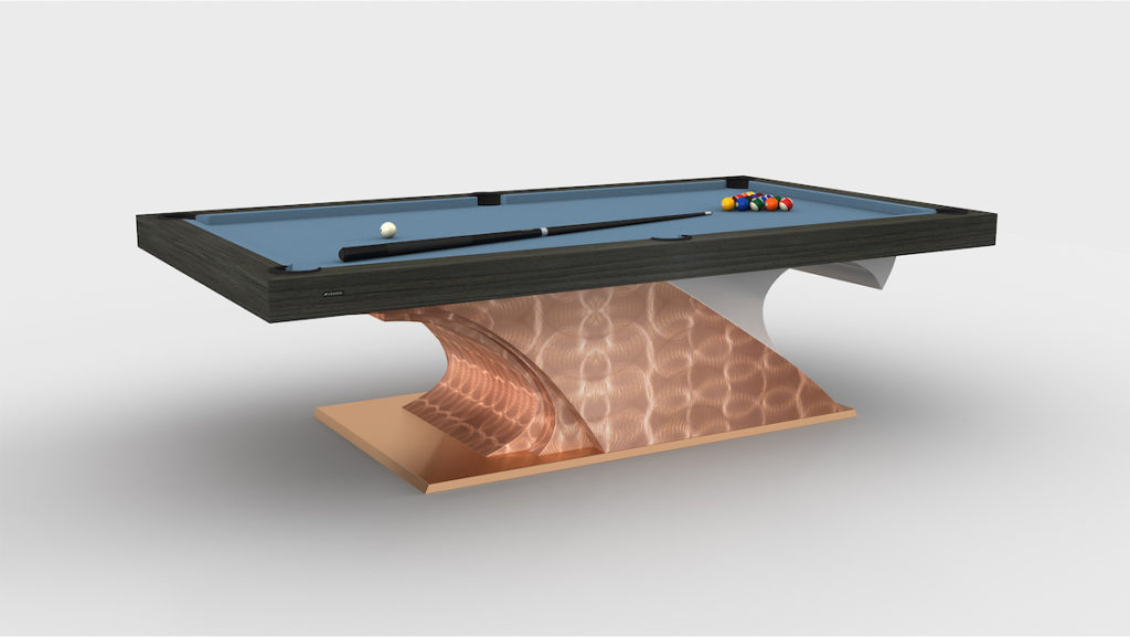 The Poseidon Pool Table is a luxury game table with a sleek wooden surface, light blue felt, and cues elegantly placed on top. It features an artistic metallic wave-like stand with a shiny copper finish and neatly arranged balls in a rack.