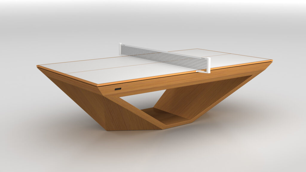 The Stealth Ping Pong Table features a modern design with a V-shaped wooden base, a sleek white playing surface, and a central net, creating a bold and contemporary centerpiece for any space.