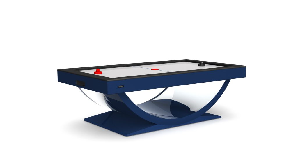 The Theseus Air Hockey Table features a luxurious blue frame with a curved base, showcasing opulence. Its modern design includes a spotless white playing surface, paired with red and black paddles and a puck.