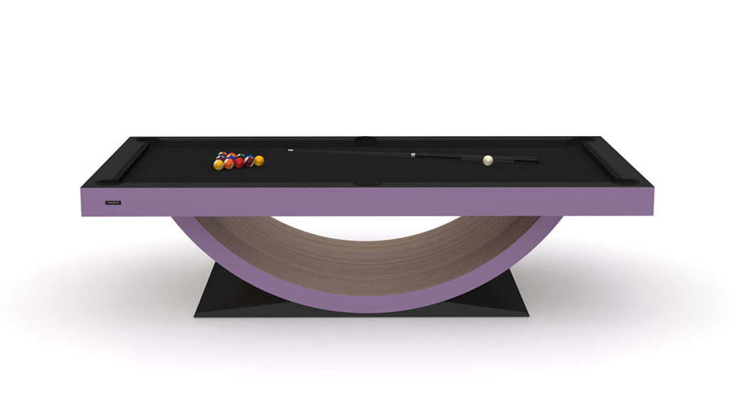 The Theseus Pool Table boasts a modern design with a distinctive curved wooden base and sleek black surface. It comes with pool balls arranged in a triangle, along with a cue stick and white cue ball, highlighting its sophisticated appeal.