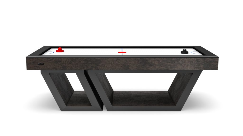 The Titan Air Hockey Table has a sleek geometric base, a pristine white surface, and bold red and black strikers with a red puck, combining style and playfulness.