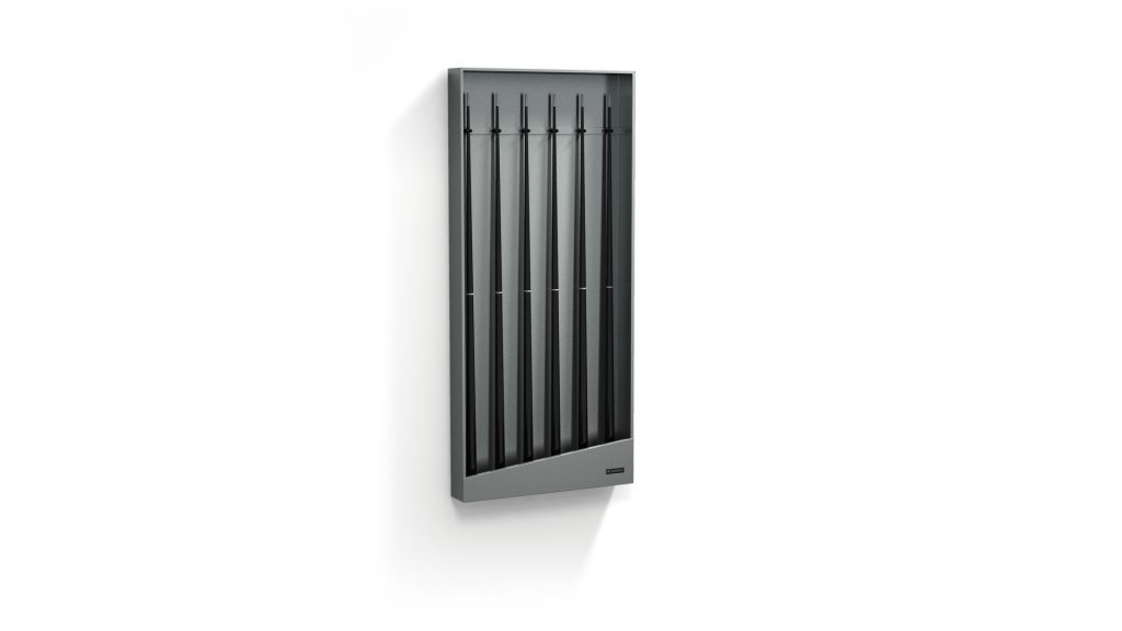 A modern black Titan Cue Rack, featuring a vertical rectangle design with five slim, evenly spaced rods, is mounted on a white wall. Its minimalist style casts a subtle shadow.