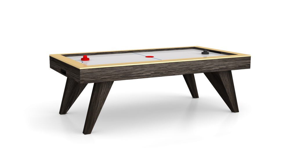 Discover elegance with the Trigon Air Hockey Table, featuring a wooden frame and angled legs. The smooth white surface has a central dividing line, while red and black strikers are positioned on opposite ends for competitive gameplay.
