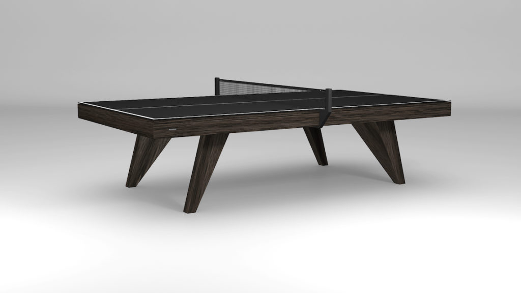 The Trigon Ping Pong Table is a sleek, modern table tennis table with a black top and slender net. Featuring angled wooden legs and a minimalist design on a plain gray background, its perfect for enhancing any stylish game room.